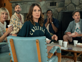 The friends sitting in a hotel lobby looking back at something in The Four Seasons.