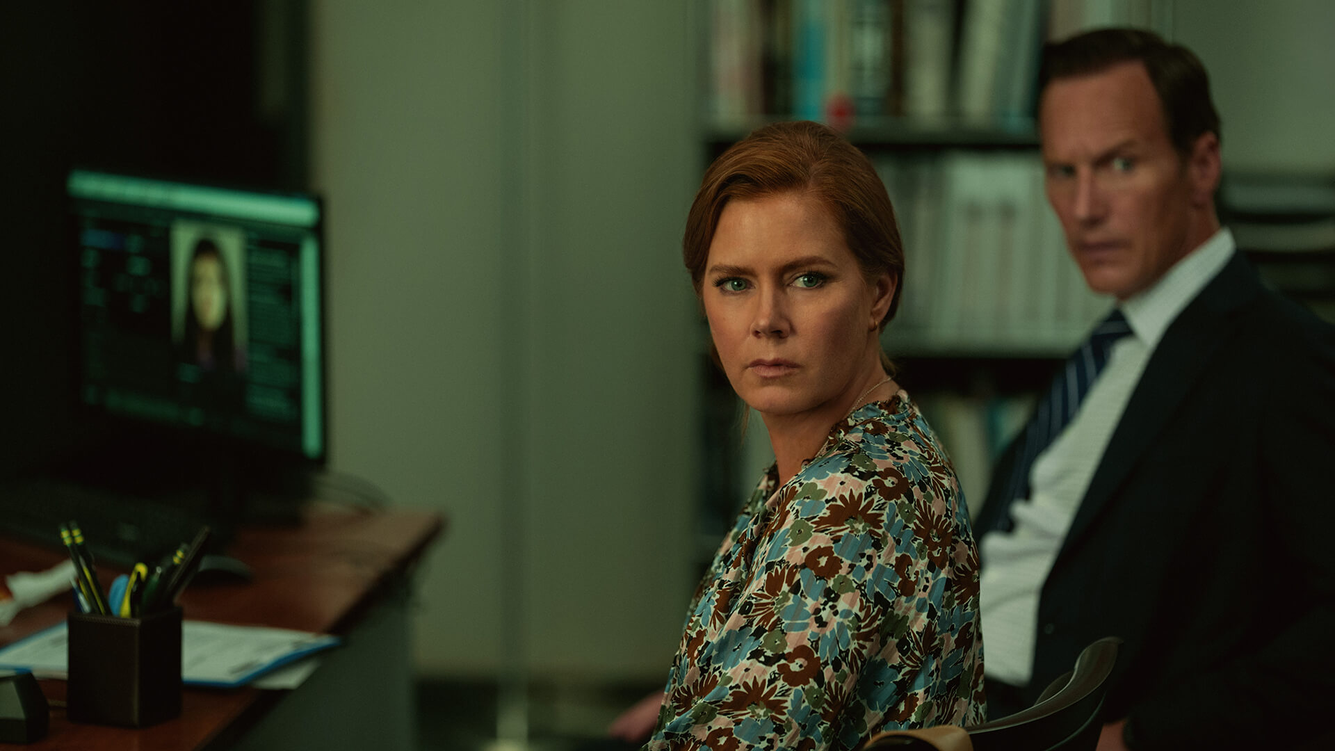 Anna and Tom sitting in an office looking back in Cape Fear.