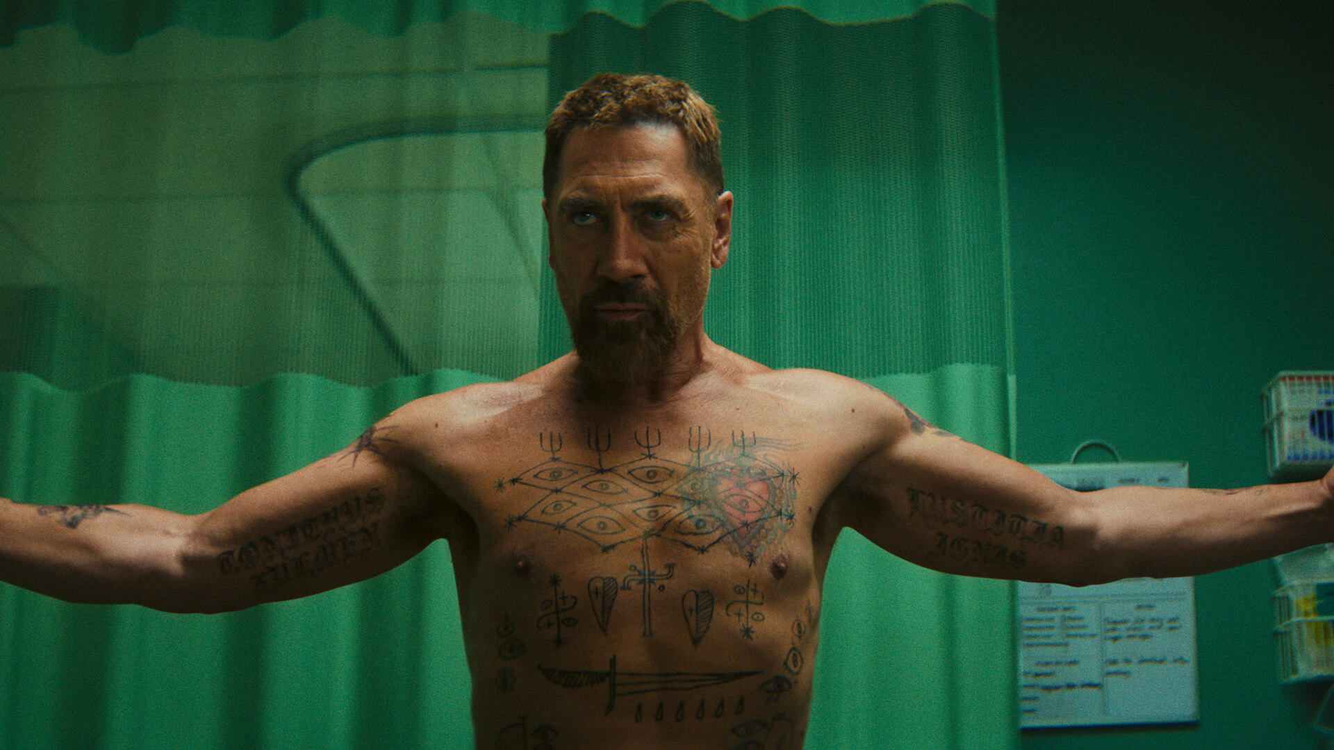 Max shirtless holding out both arms in Cape Fear.