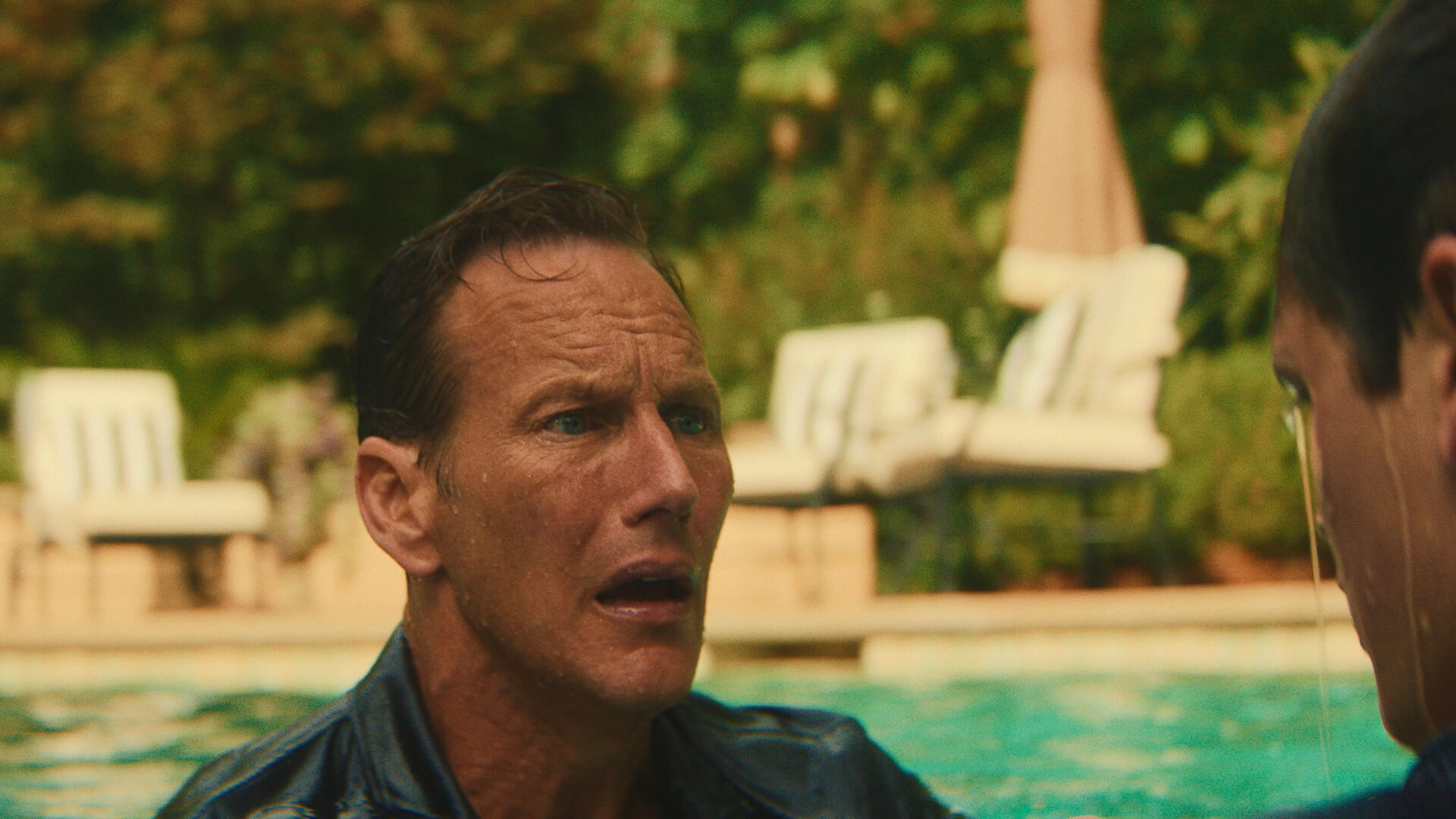 Tom looking at Nick in the pool, distraught in Cape Fear.