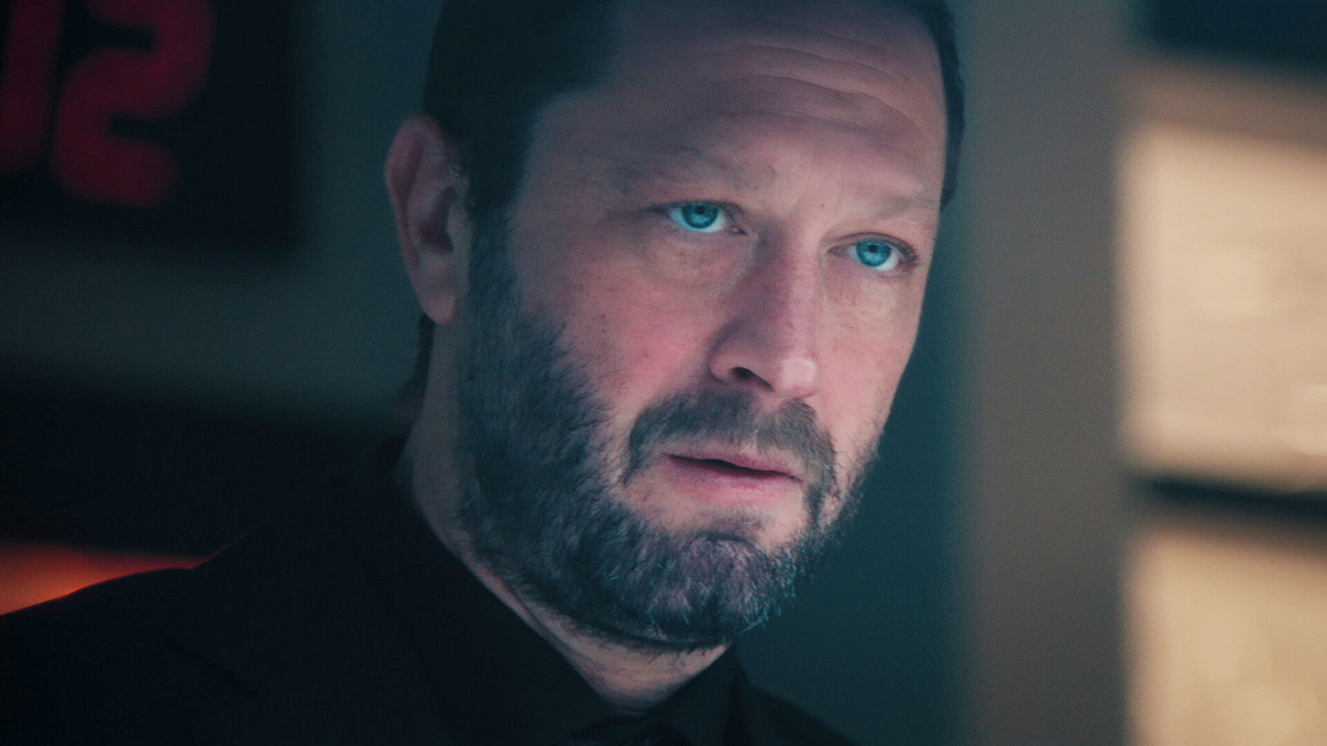 A close-up of Richie looking worried in The Bear.