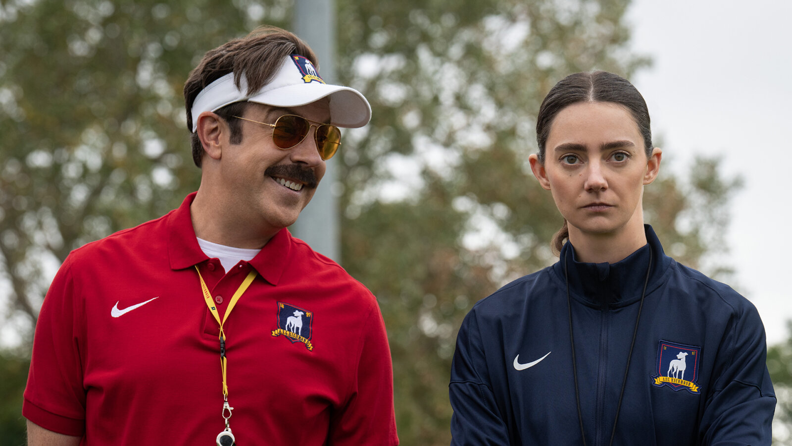 Ted looking at Alice and smiling in Ted Lasso.