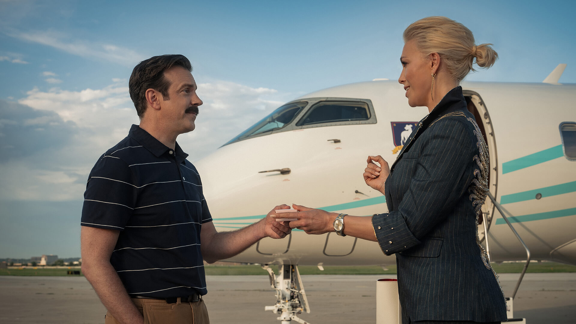 Rebecca talking to Ted on the tarmac in Ted Lasso.