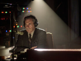 Fred Heckman wearing headphones on the radio in American Hostage.