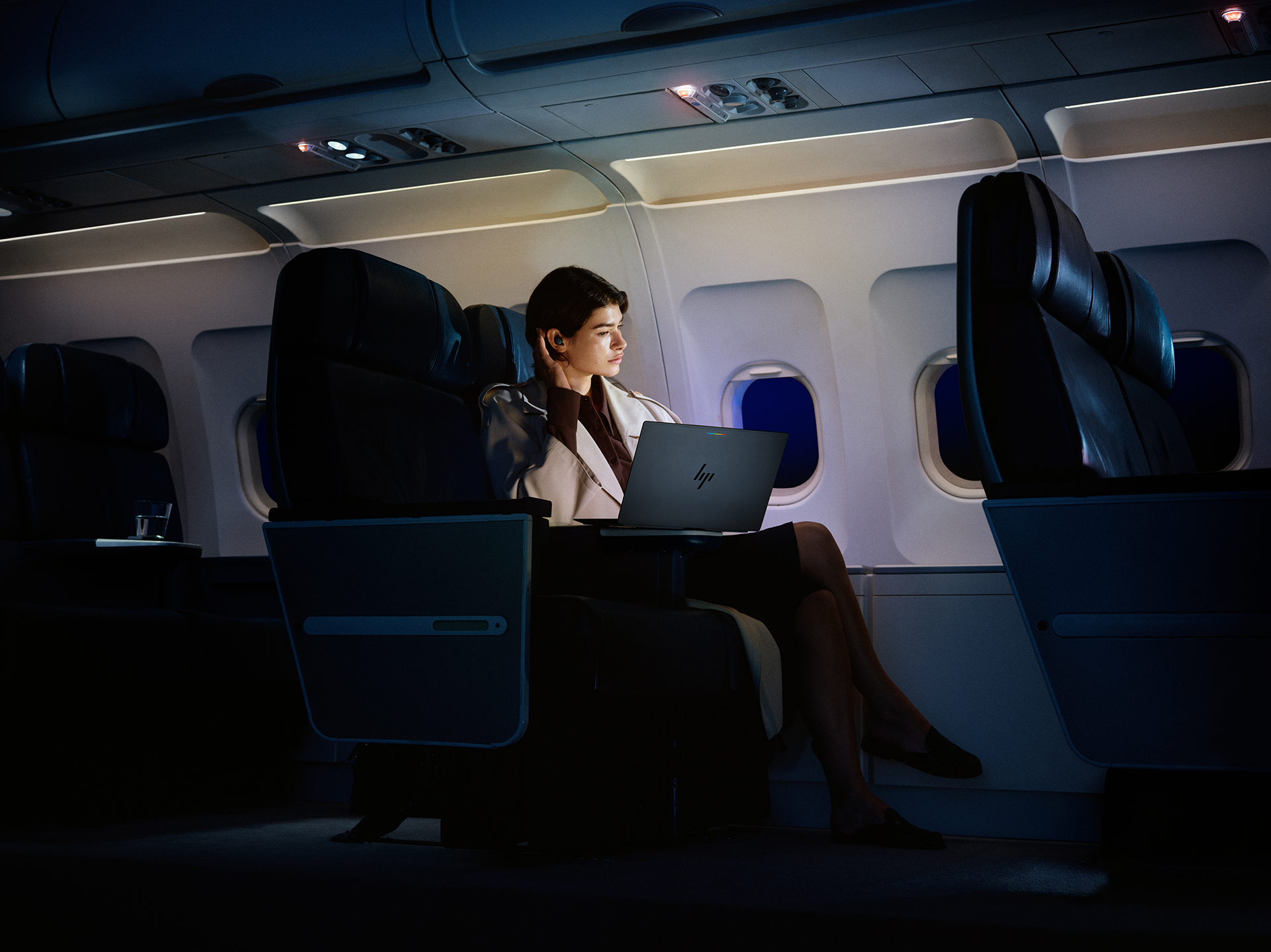 A woman on a plane with an HP Googlebook