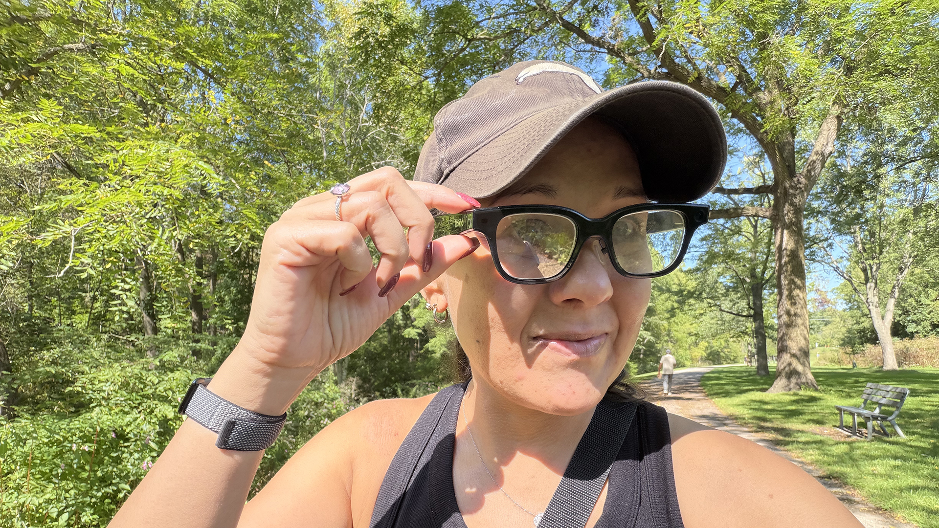 A woman outside wearing the Rokid smart glasses