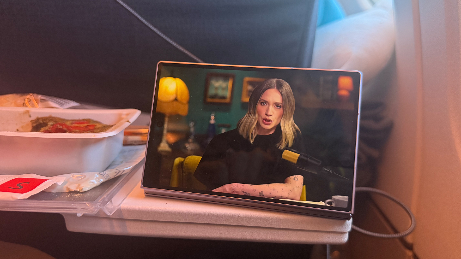 Samsung Galaxy Z Fold 8 open watching video on plane