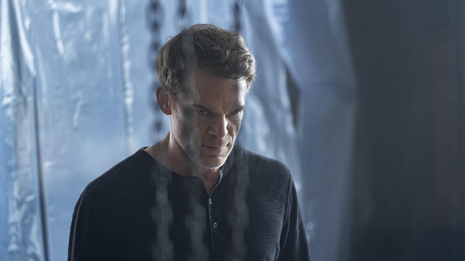 Dexter in a plastic filled room glaring in Dexter: Resurrection.