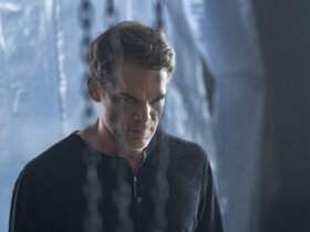 Dexter in a plastic filled room glaring in Dexter: Resurrection.